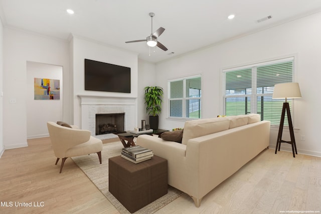 4406 John Wood Ln, Olive Branch, MS 38654 - living area with ceiling fan, light wood-style floors, crown molding, a fireplace, and recessed lighting
