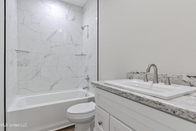 bathroom featuring vanity, toilet, and shower / bath combination