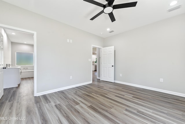 unfurnished bedroom with light wood finished floors, baseboards, ceiling fan, and recessed lighting