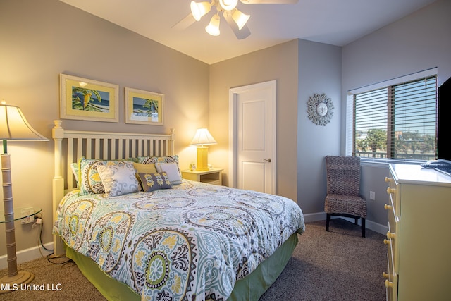 bedroom featuring baseboards, carpet floors, and a ceiling fan