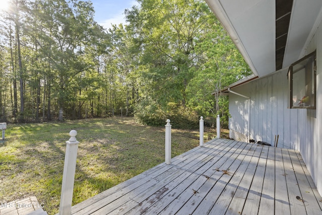 wooden deck with a yard