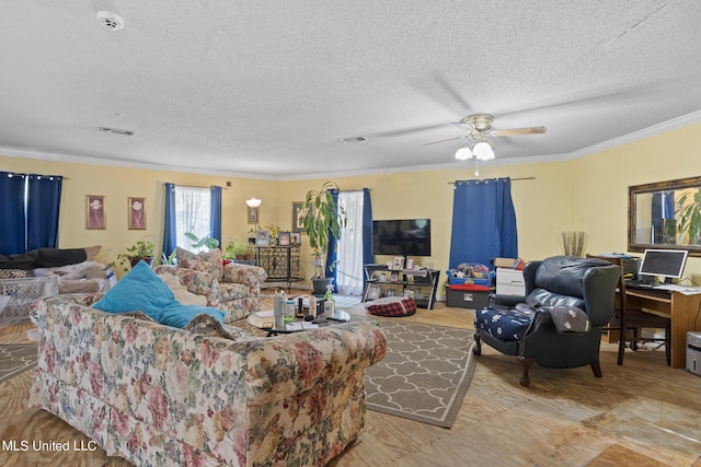 living room featuring light hardwood / wood-style floors, crown molding, a textured ceiling, and ceiling fan