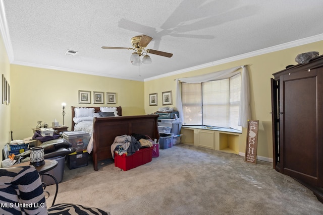 office space featuring crown molding, light colored carpet, and ceiling fan