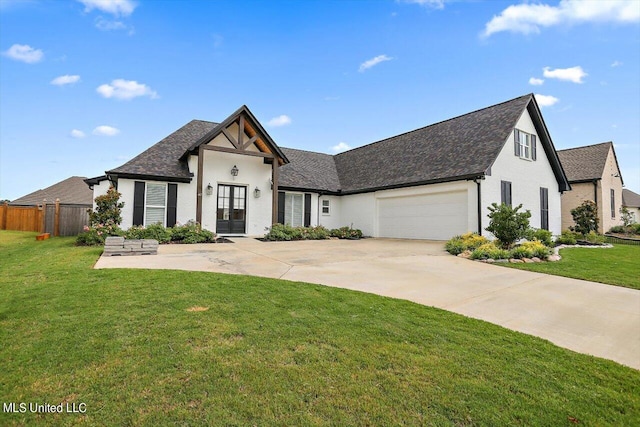 view of front of home featuring a garage and a front lawn