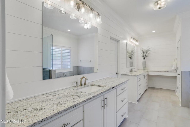 bathroom featuring vanity and ornamental molding