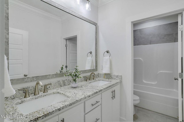 full bathroom with bathtub / shower combination, toilet, vanity, ornamental molding, and tile patterned flooring