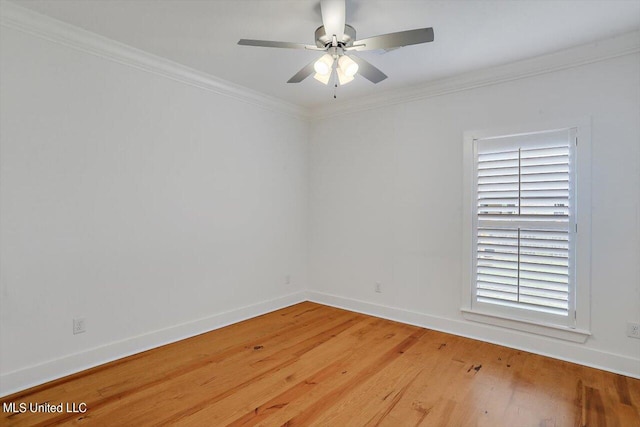 spare room featuring ornamental molding, hardwood / wood-style floors, and ceiling fan