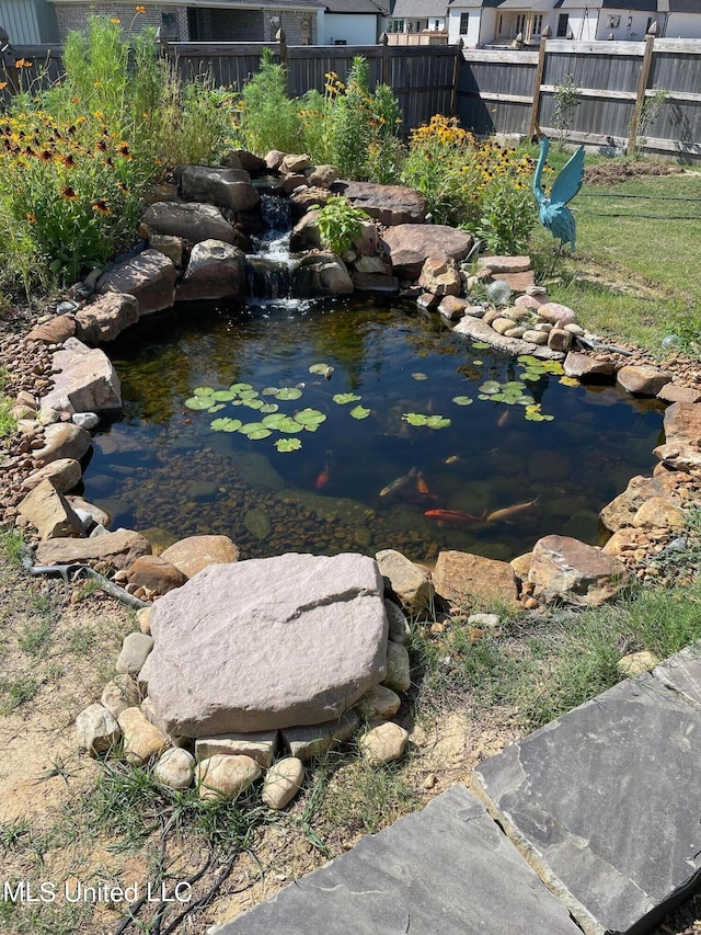 view of yard with a garden pond