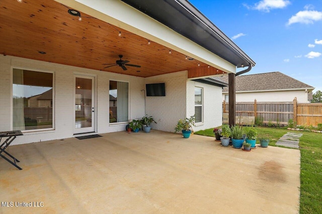 view of patio featuring ceiling fan