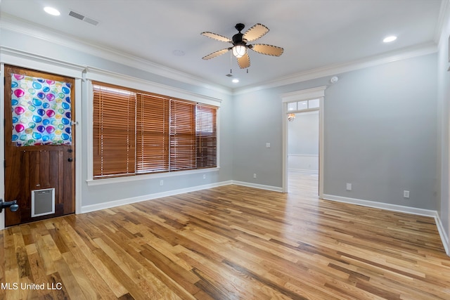 spare room with ornamental molding, light hardwood / wood-style floors, and ceiling fan