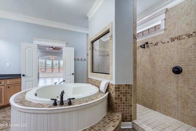 bathroom featuring crown molding, vanity, and separate shower and tub