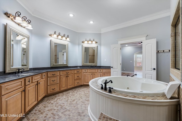 bathroom featuring vanity, a washtub, and crown molding