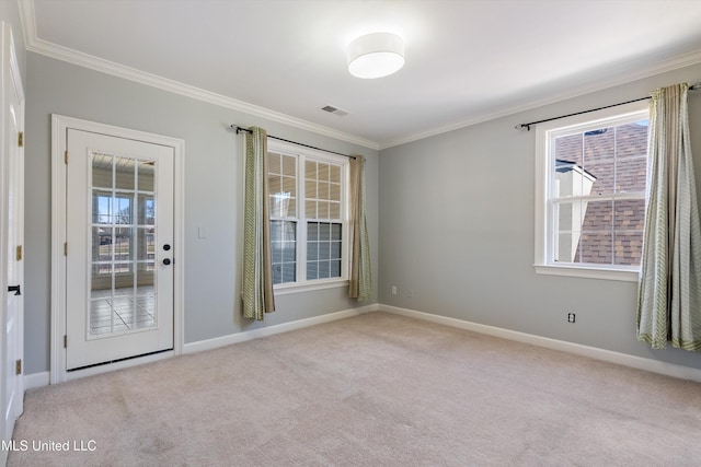 unfurnished room featuring ornamental molding and light carpet