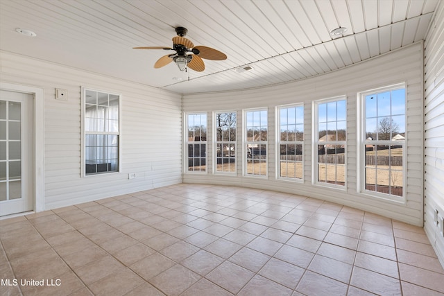 unfurnished sunroom featuring wooden ceiling and ceiling fan