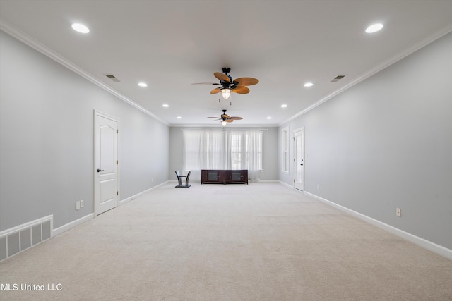 unfurnished living room with crown molding, light colored carpet, and ceiling fan