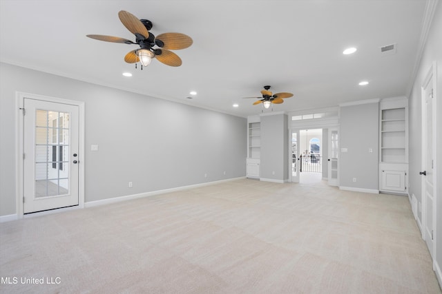 unfurnished living room with ornamental molding, a healthy amount of sunlight, light carpet, and ceiling fan