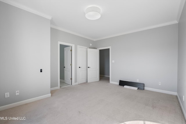 unfurnished bedroom featuring light carpet and ornamental molding