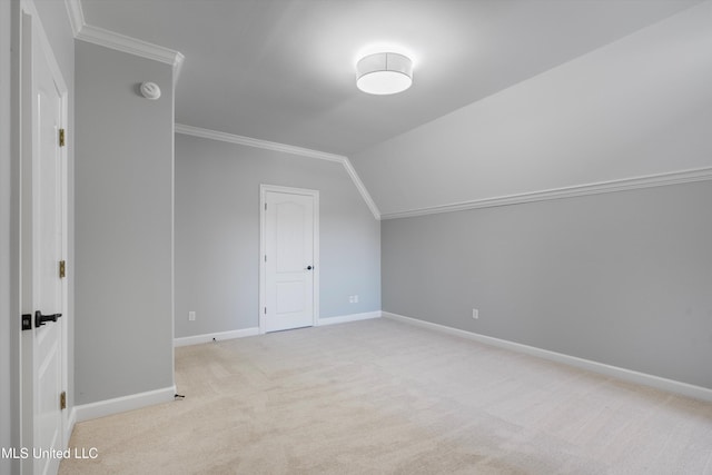 bonus room with vaulted ceiling and light colored carpet