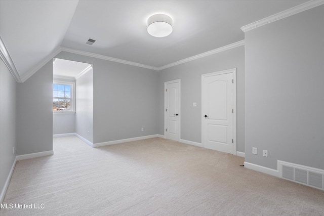 additional living space with light colored carpet and vaulted ceiling