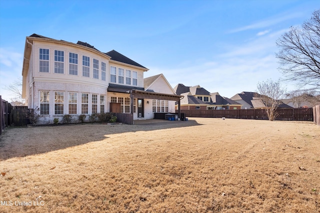 rear view of property featuring cooling unit and a patio area