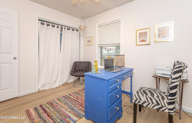 sitting room featuring light hardwood / wood-style flooring and ceiling fan