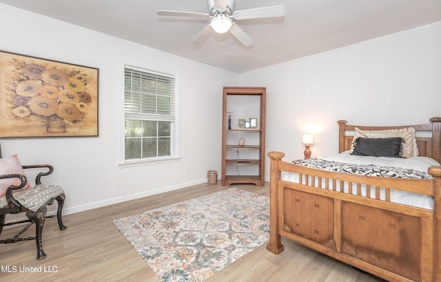 bedroom with light wood-type flooring and ceiling fan