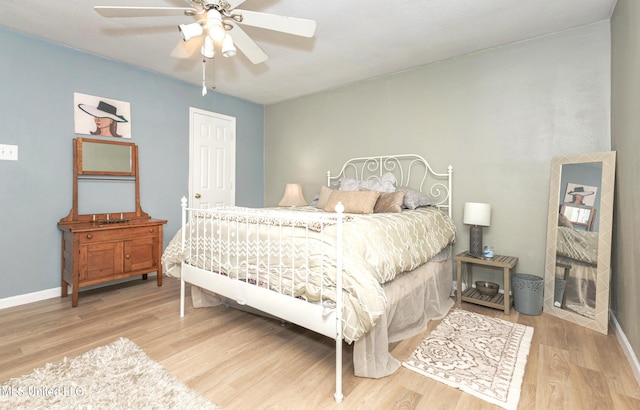 bedroom featuring ceiling fan and light hardwood / wood-style floors