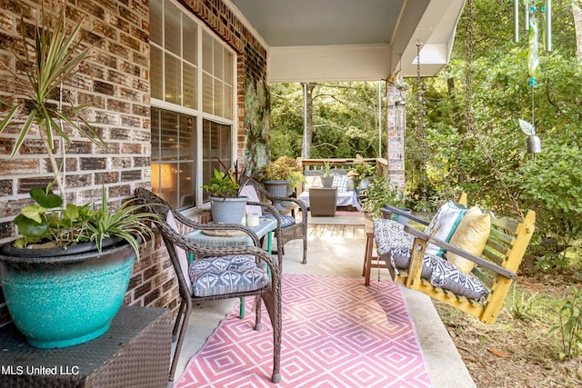 view of patio with outdoor lounge area and covered porch