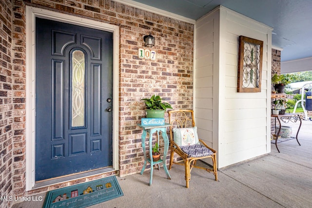 entrance to property with a porch