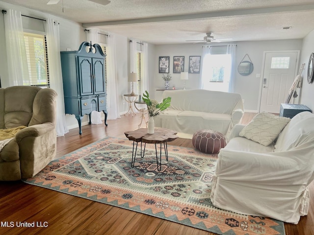 3620 Cochran Ave, Moss Point, MS 39562 - living area with a ceiling fan, wood finished floors, a textured ceiling, and baseboards