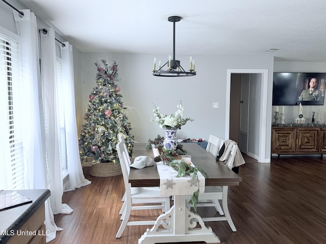 3620 Cochran Ave, Moss Point, MS 39562 - dining room with a chandelier, wood finished floors, and healthy amount of natural light