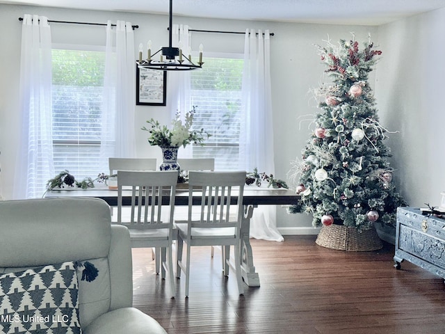 3620 Cochran Ave, Moss Point, MS 39562 - dining room featuring a chandelier, wood finished floors, and baseboards
