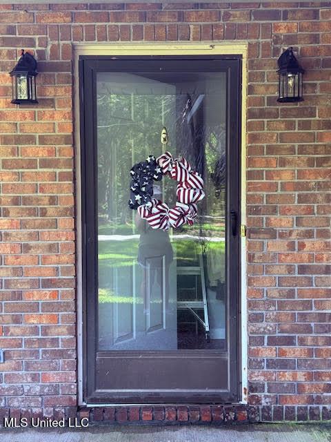 3620 Cochran Ave, Moss Point, MS 39562 - doorway to property with brick siding