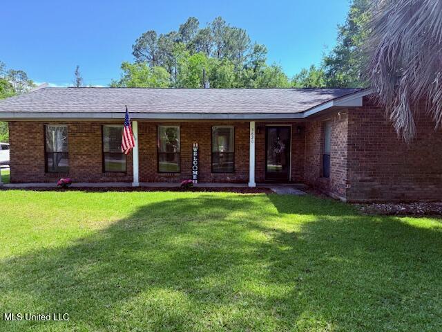 3620 Cochran Ave, Moss Point, MS 39562 - single story home featuring a front lawn, brick siding, and a porch