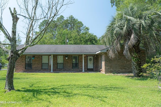 3620 Cochran Ave, Moss Point, MS 39562 - view of front facade featuring a front yard, brick siding, and a porch