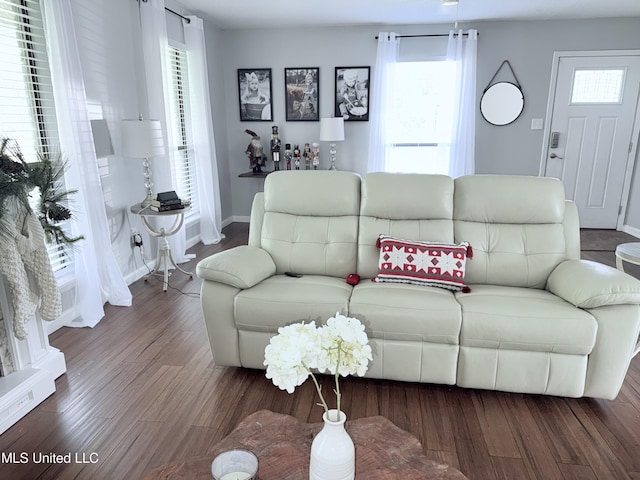 3620 Cochran Ave, Moss Point, MS 39562 - living area featuring healthy amount of natural light, wood finished floors, and baseboards