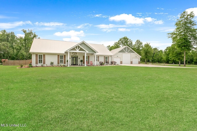view of front of property featuring a porch, concrete driveway, fence, a garage, and a front yard