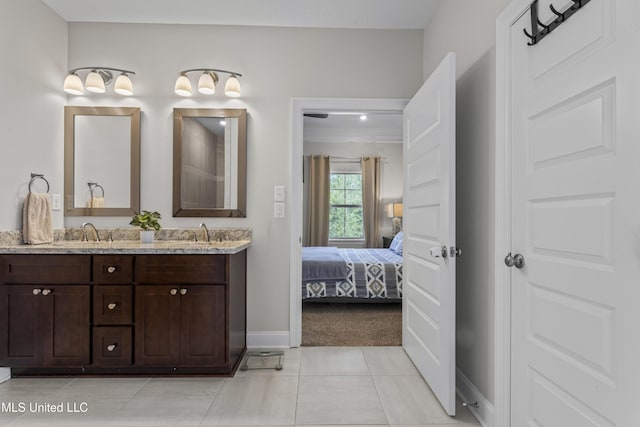 5705 Via Toscana, Ocean Springs, MS 39564 - ensuite bathroom with baseboards, tile patterned floors, and double vanity