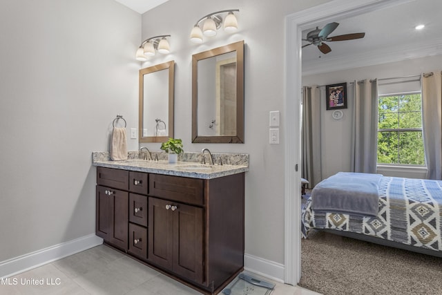 5705 Via Toscana, Ocean Springs, MS 39564 - ensuite bathroom featuring baseboards, crown molding, double vanity, and a ceiling fan