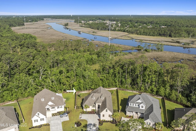 5705 Via Toscana, Ocean Springs, MS 39564 - aerial view of residential area featuring a heavily wooded area and a large body of water