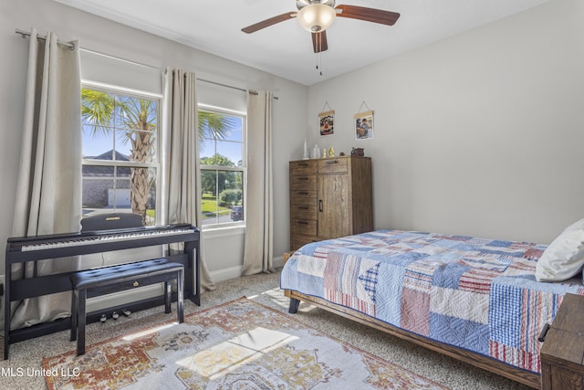 5705 Via Toscana, Ocean Springs, MS 39564 - carpeted bedroom with a ceiling fan and baseboards