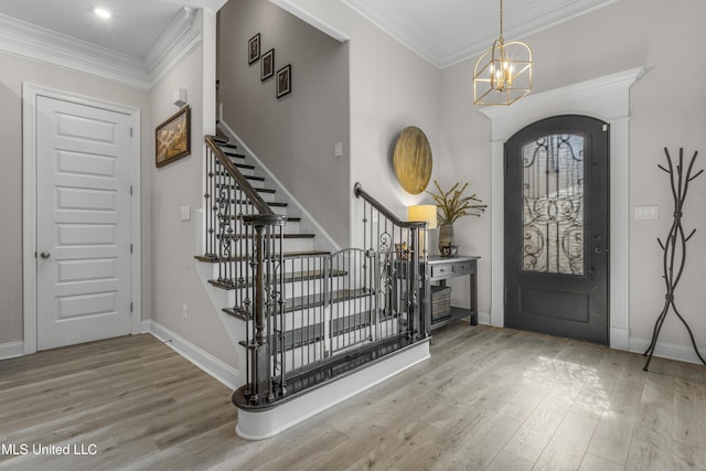 5705 Via Toscana, Ocean Springs, MS 39564 - foyer with wood finished floors, stairs, arched walkways, baseboards, and ornamental molding