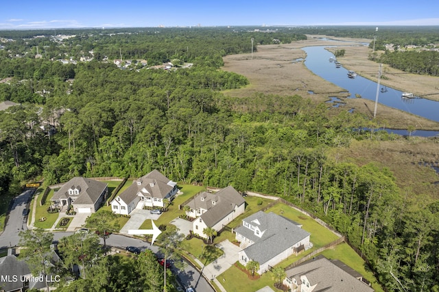 5705 Via Toscana, Ocean Springs, MS 39564 - aerial perspective of suburban area with a large body of water and a forest