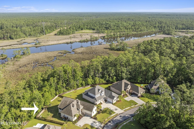 5705 Via Toscana, Ocean Springs, MS 39564 - aerial view of property's location featuring a forest and a large body of water