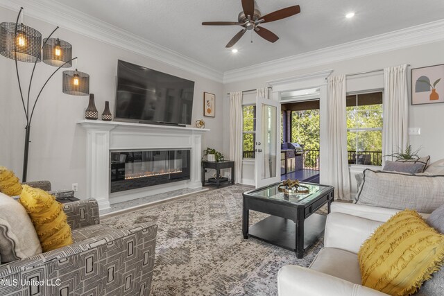5705 Via Toscana, Ocean Springs, MS 39564 - living area with ceiling fan, a high end fireplace, and crown molding