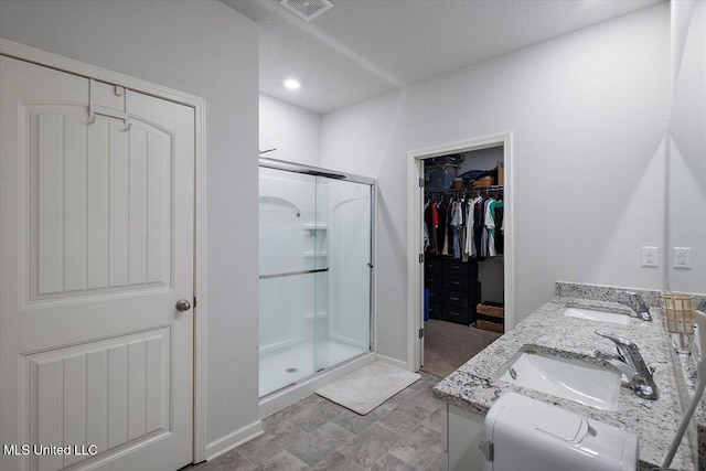 2250 Hyacinth Ln, Hernando, MS 38632 - full bathroom with a stall shower, a spacious closet, and double vanity