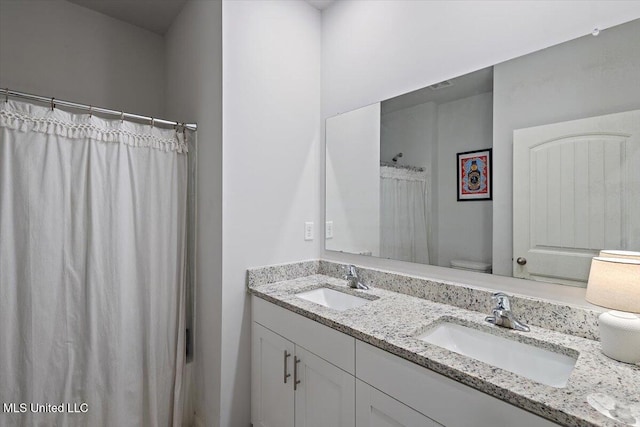 2250 Hyacinth Ln, Hernando, MS 38632 - bathroom with double vanity and a shower with shower curtain