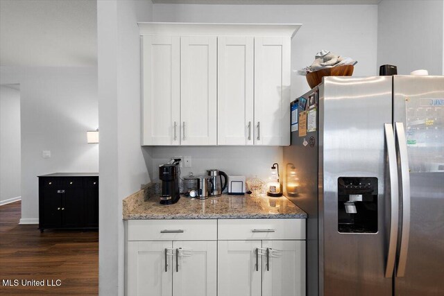 2250 Hyacinth Ln, Hernando, MS 38632 - kitchen with stainless steel refrigerator with ice dispenser, dark wood-style flooring, white cabinetry, and light stone counters