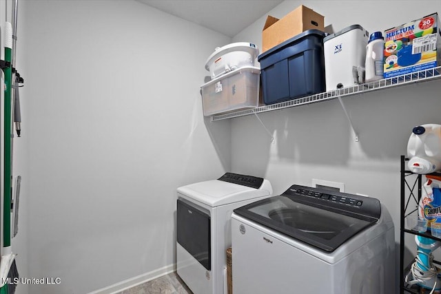 2250 Hyacinth Ln, Hernando, MS 38632 - laundry room featuring independent washer and dryer and baseboards