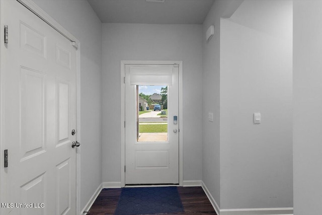 2250 Hyacinth Ln, Hernando, MS 38632 - doorway to outside featuring dark wood-type flooring and baseboards